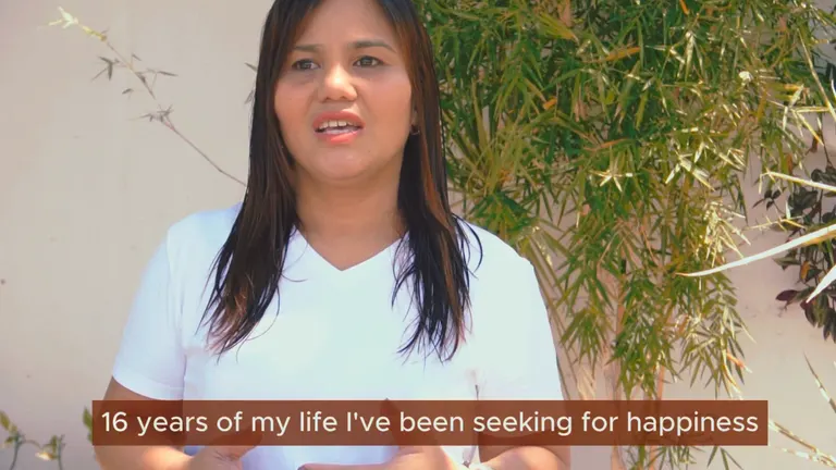 Charina Nugpo speaking to camera beside the bamboo at the Tallaro Healing Center.